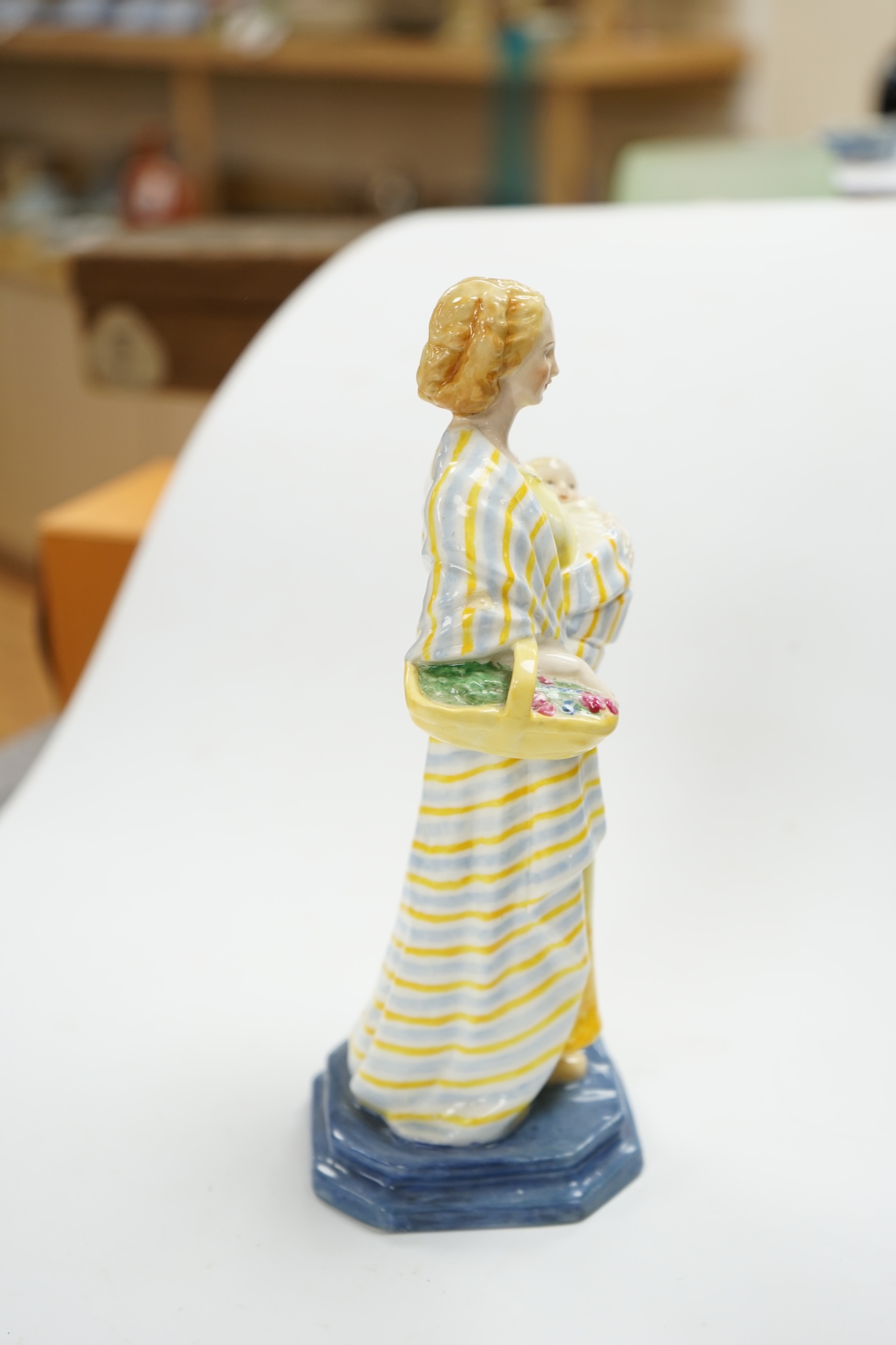 A Royal Worcester figure, 'A Flower girl', modelled by Phoebe Stabler, 20.5cm high. Condition - good